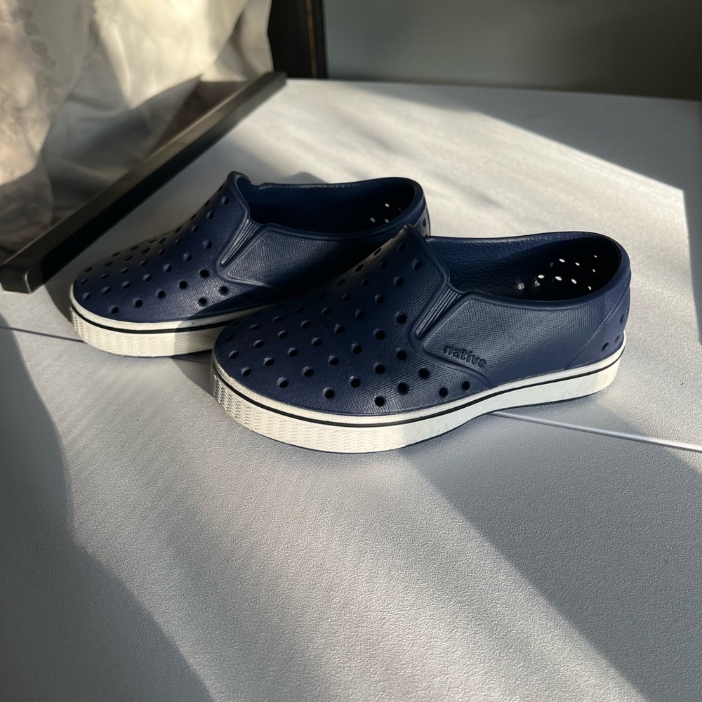 Native Perforated Navy Slip-Ons with White Soles size 8C